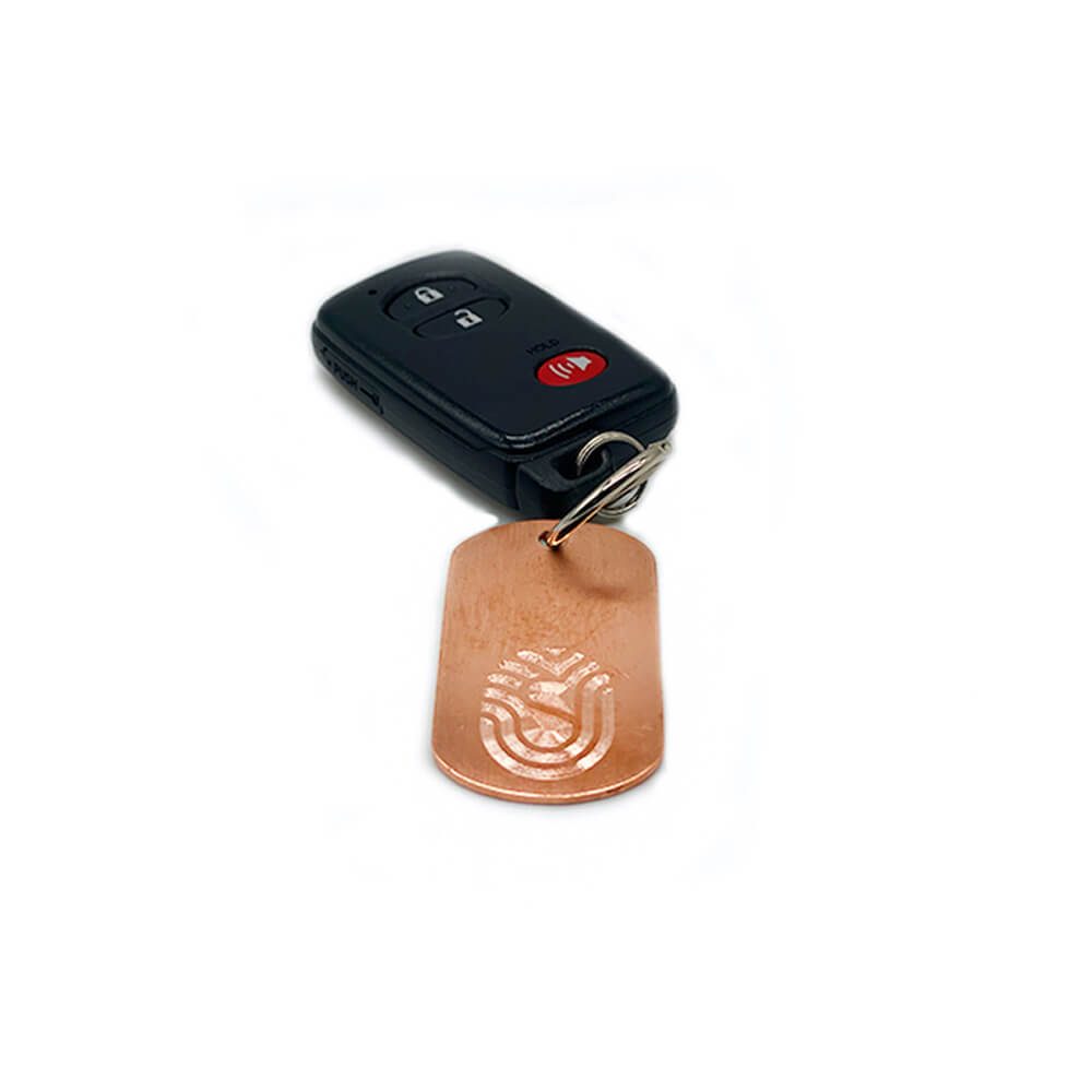 Black car key fob on keychain ring with copper dog tag keychain plate with Staywell logo - the copper  kills 99.97% of germs and bacteria!